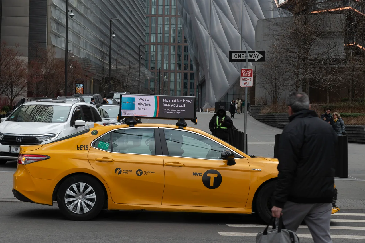Discover advertisement on a digital taxi top display in New York City