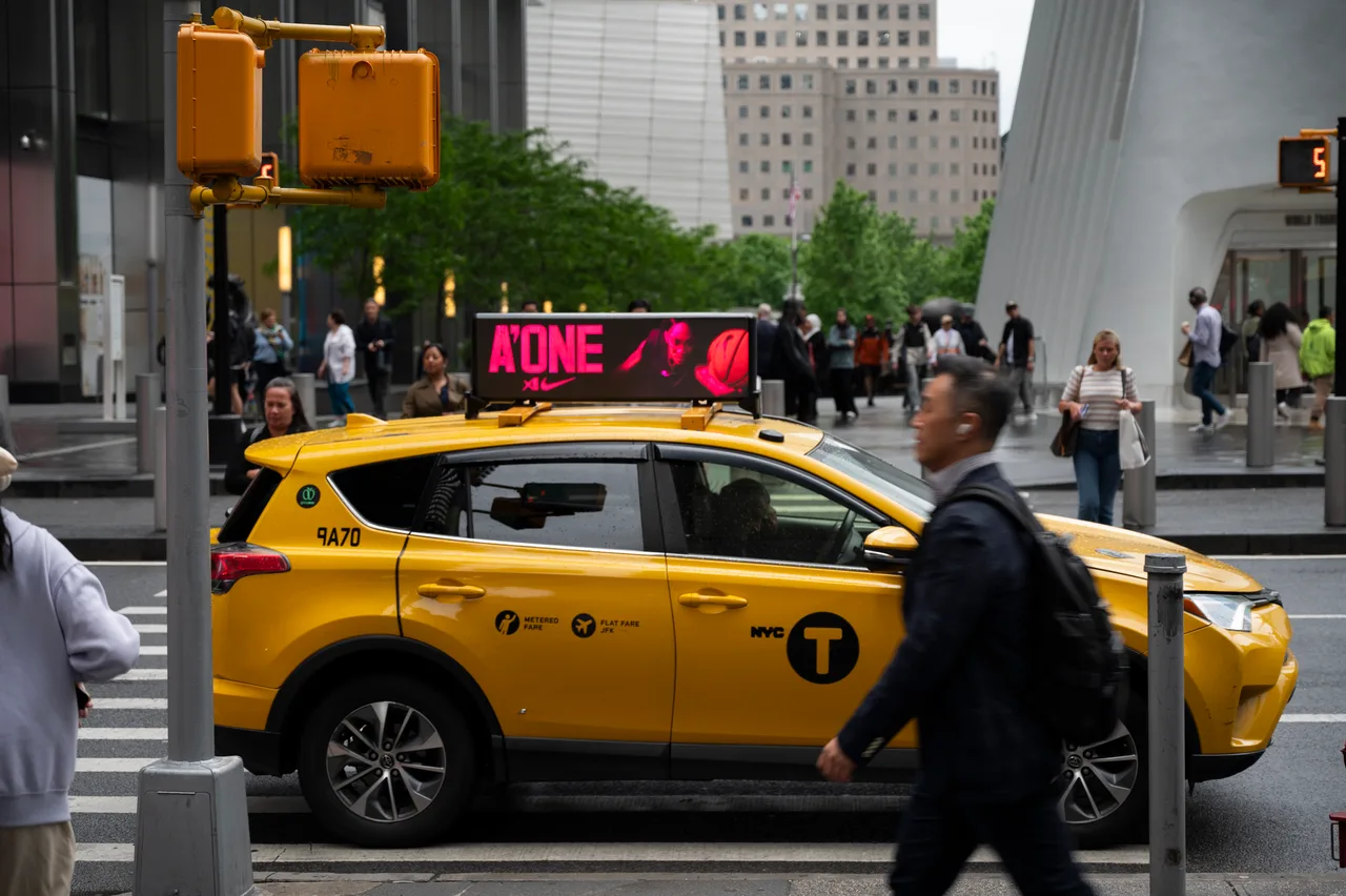 Nike advertisement on a digital taxi top display in New York City