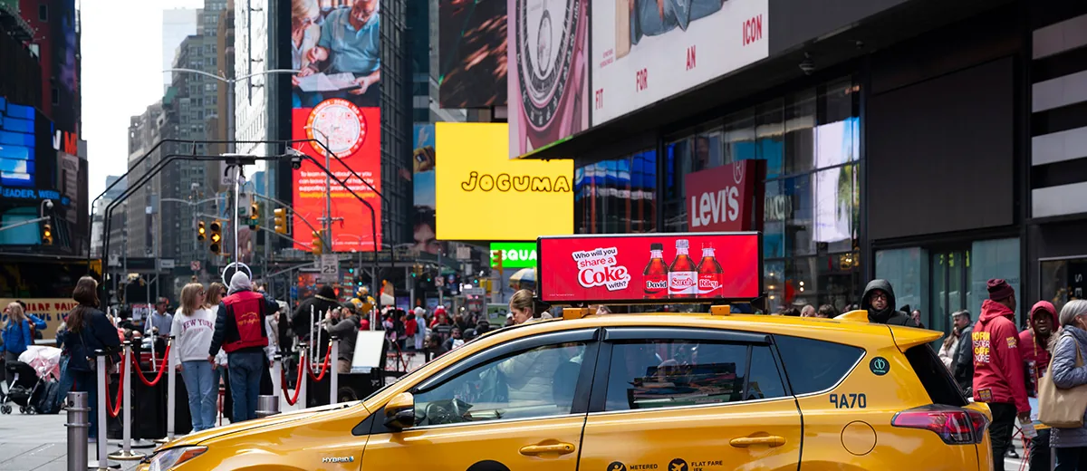 Stacked LED advertising screens on the building faces above Times Square, New York